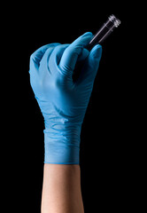 Doctor's hand in medical gloves holding test tube with coronavirus COVID-19