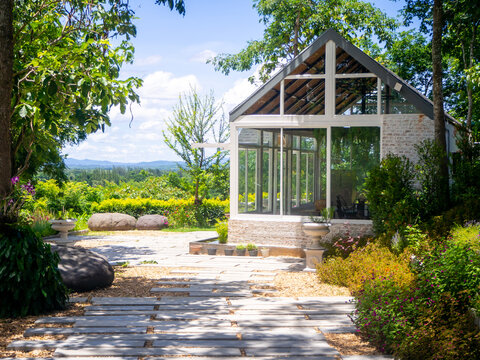 A garden center greenhouse with  potted plants and flowers