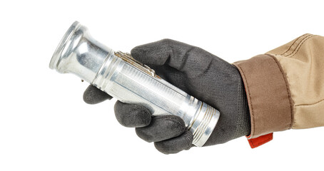 Worker hand in black protective glove and brown uniform with small old aluminum flashlight isolated on white background