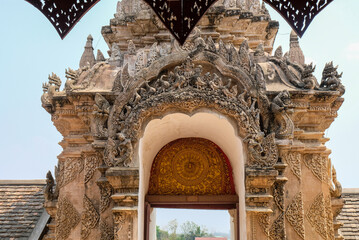 Area entrance gate of Wat Phra That Lampang Luang, Lanna pagoda in Lampang. One of the landmark and Many people come to worship the holy thing at Lampang province, Thailand.