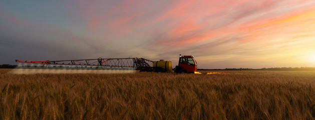Machine for spraying pesticides and herbicides on a field at night.