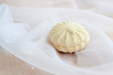 Marshmallow. Vanilla sweet homemade marshmallows. Light composition with transparent fabric. Sweet delicious dessert.