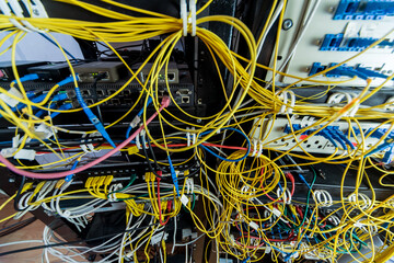 Server room with computers for internet. Network cables connected to switches.