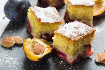 Homemade plum cake and a plum.