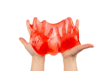 Red slime toy in woman hand isolated on white.