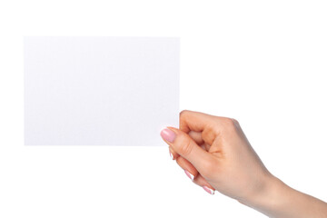 Woman's hand holding blank white sheet of paper isolated on white