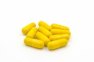 Turmeric powder in capsule isolated on white background