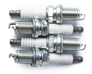 Car part. Spark plugs isolated on white.