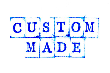 Blue ink of rubber stamp in word custom made on white paper background
