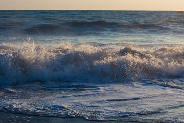 big waves in the evening at sea