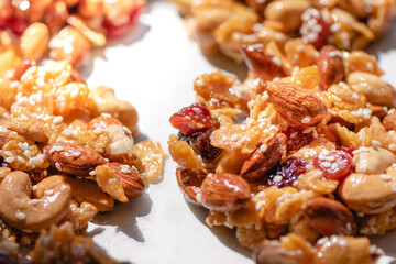 The process of making homemade cereal cookies, Is an easy-to-make food for health lovers,Cashew,Almonds,Corn cereal,raisin,Dried Strawberries,White sesame ,honey,egg white, Selective focus.