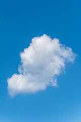 Fototapeta na wymiar single cloud on a blue sky