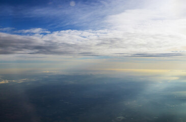 Fototapeta na wymiar Beautiful fantastic blue sky into through aircraft window
