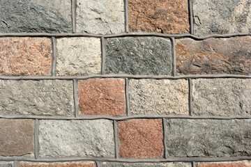 The texture of the stone wall.