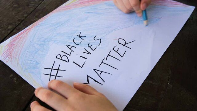 Kid boy paint drawing for support black lives matter protest in USA, no racism 