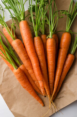 Vertical image.Fresh and juicy carrots on the paper packaging