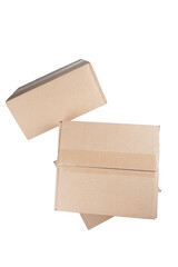 isolated close up shot of three stacked closed rectangular blank brown carton cardboard boxes on a white background