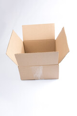 isolated close up shot of a single open blank brown empty carton cardboard box on a white background