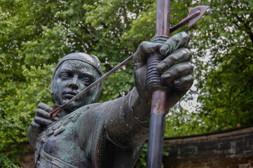 Detail of the statue of Robin Hood standing near Nottingham Castle in Nottingham, England.
