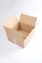 isolated close up shot of a single open blank brown empty carton cardboard box on a white background
