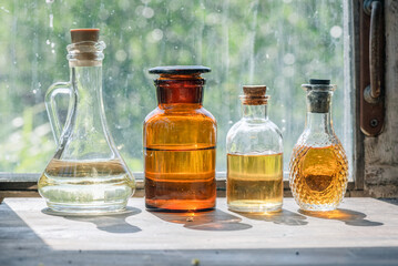 Magic potion bottles and dried plants on the witch doctor table. Witchcraft.