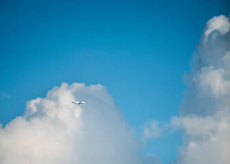 Aeroplane crossing thick clouds in Delhi sky, India