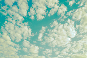 Pastel blue sky with clouds.
