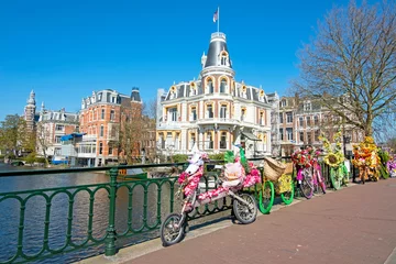Gardinen Bikes decorated with flowers in Amsterdam the Netherlands © Nataraj