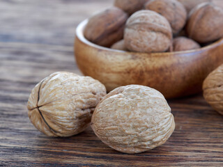 Walnuts lie on a colored wooden background.Nuts are good for your health.Vegan