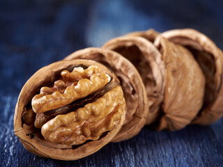 Walnuts lie on a colored wooden background.Nuts are good for your health.Vegan