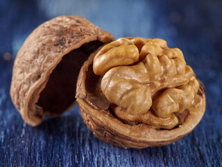 Walnuts lie on a colored wooden background.Nuts are good for your health.Vegan