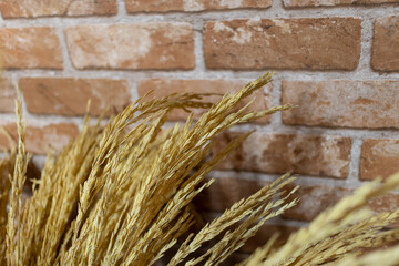 ears of wheat on a retro bricks background.