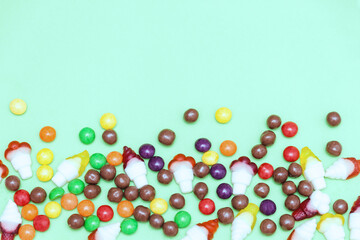 Colorful chocolate, jelly, sugar candies. Top view, copy space.