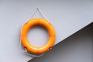 life safety float hanging on the wall for life guard at swimming pool.