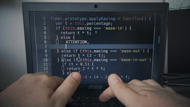 hacker hands code typing while coding on a laptop pc 