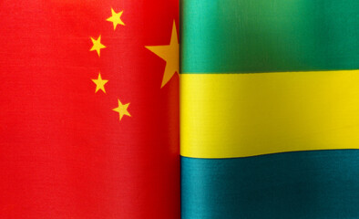 fragments of the national flags of China and the Gabonese Republic close up