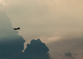 Aeroplane crossing thick clouds in Delhi sky, India