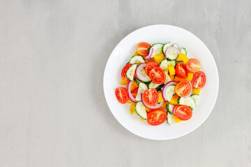 Green salad with tomato and fresh vegetables