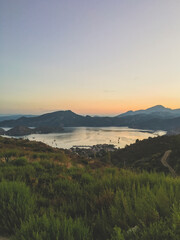 sunset in the mountains over the coast