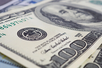American US money bills of face value of 100 dollars old and new type close-up. National currency....