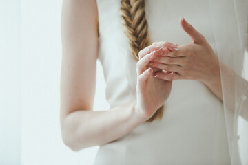 Image of female manicured hands on white background
