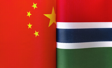 fragments of the national flags of China and the Republic of the Gambia close up