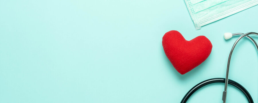Table top view aerial image of accessories healthcare & medical with Valentines day background concept.Flat lay stethoscope with sign treatment heart shape sick on pink paper.National Organ Donor Day.