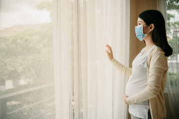 Asian pregnant women beautiful girl wearing medical masks due to illness, dizziness. Healthy...