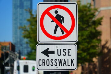 No pedestrians use crosswalk, sign    