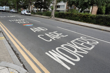 Obraz premium London / UK – June 7, 2020: a message thanking NHS and care workers written on Park Road, Crouch End, north London, amid the ongoing coronavirus crisis