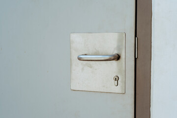 Stainless steel door handle and background photo