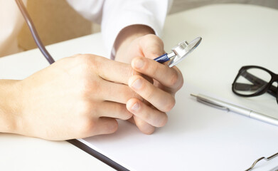 Doctor holding a stethoscope blood pressure man patient Health care in hospital.