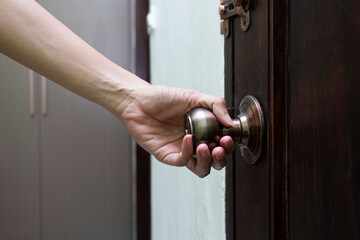hand hold handle of door, close up