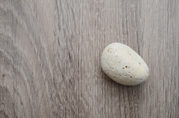 Fototapeta na wymiar Rock stone on wooden